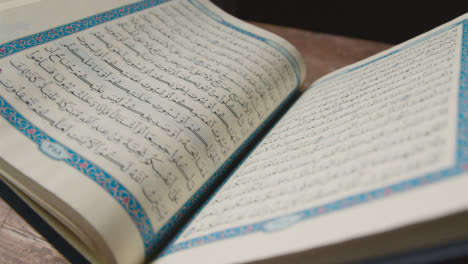A-Handheld-Shot-of-the-Quran-Religious-Text-Pages